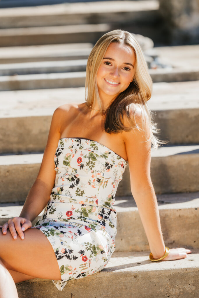girl sits on stairs