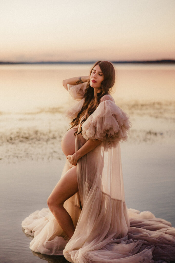close up of pregnant bump with water. 