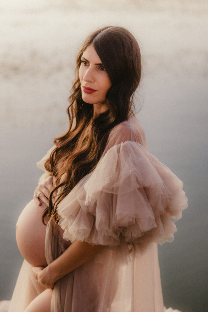Stunning close up of a pregnant women in the lake. 