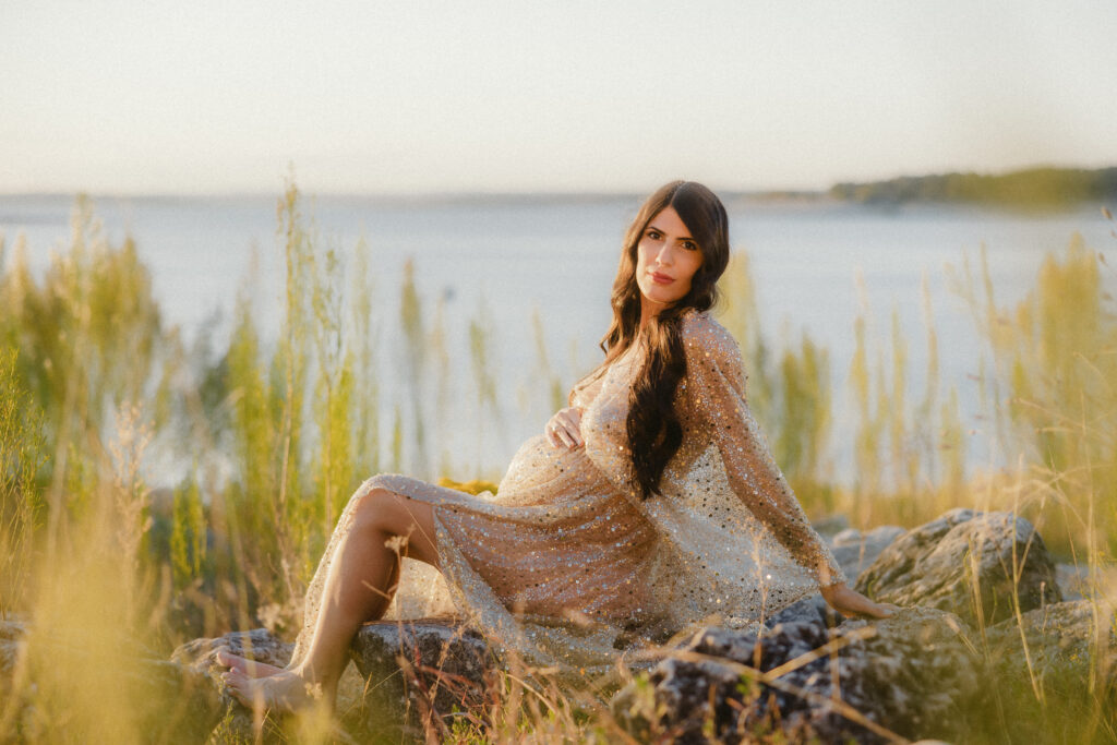 Pregnant mom sits for a maternity portrait. 