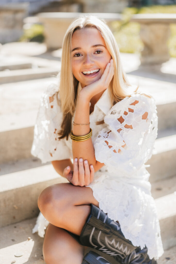 girl sits in white dress